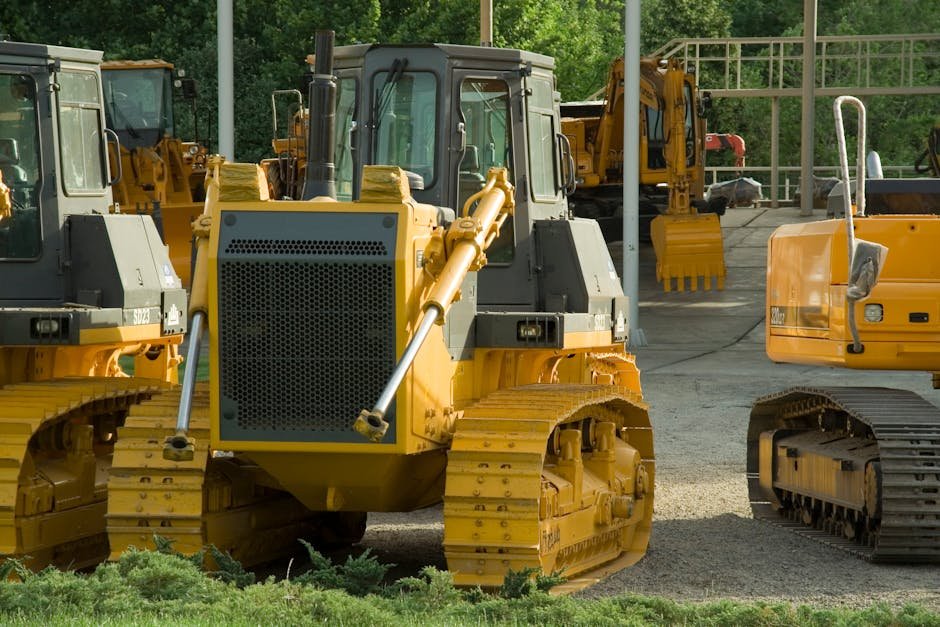 Excavator parked on firm ground outdoors during storage between jobs